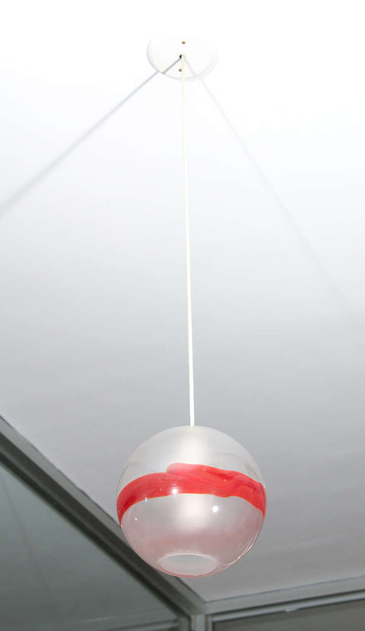 Handblown glass pendant, mfg. Venini with red stripe. We had a pair of these which hung in our showroom for the past 20 years. One broke so we have decided to part with the remaining single fixture.
