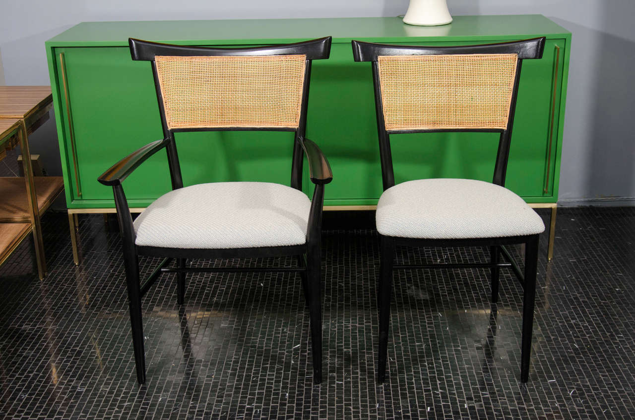 Set of 6 black lacquered cane and fabric dining chairs by Paul McCobb.  Coordinating table listed separately.