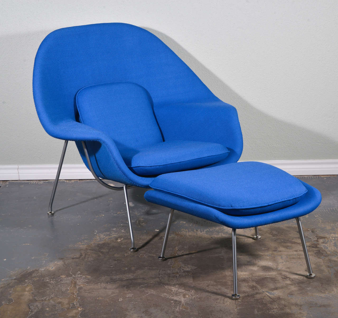Beautiful vintage Knoll womb chair and ottoman restored in Vintage Alexander Girard Fabric.