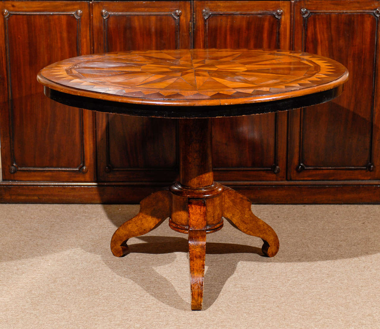 An Italian center table with parquetry inlaid top with tripod pedestal base. 

William Word Fine Antiques: Atlanta's source for antique interiors since 1956.