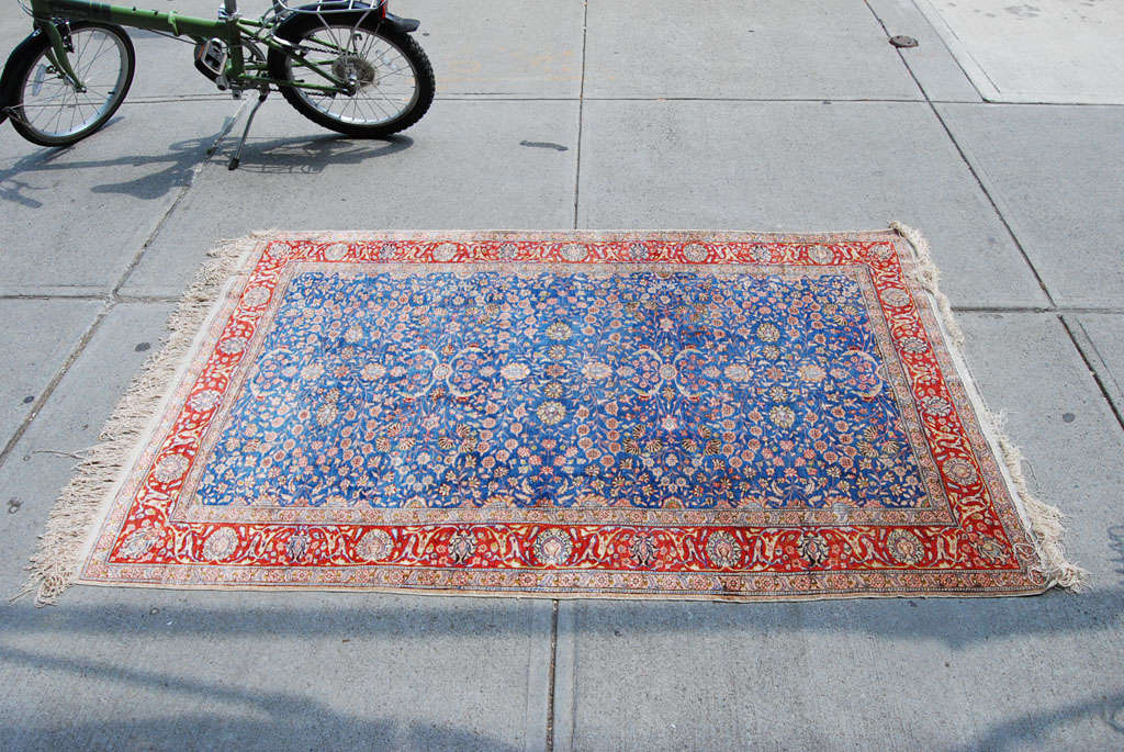 Beautiful silk carpet from Persian called Herekeh, in shades of rose and blue, floral pattern