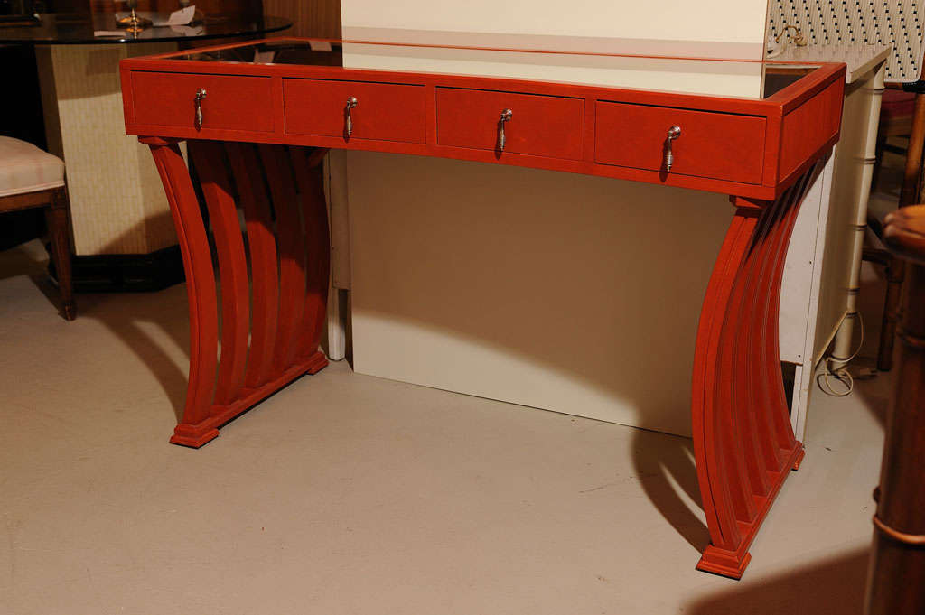 Mahogany console or vanity with 4 drawers painted in coral colour. Newer mirror top.