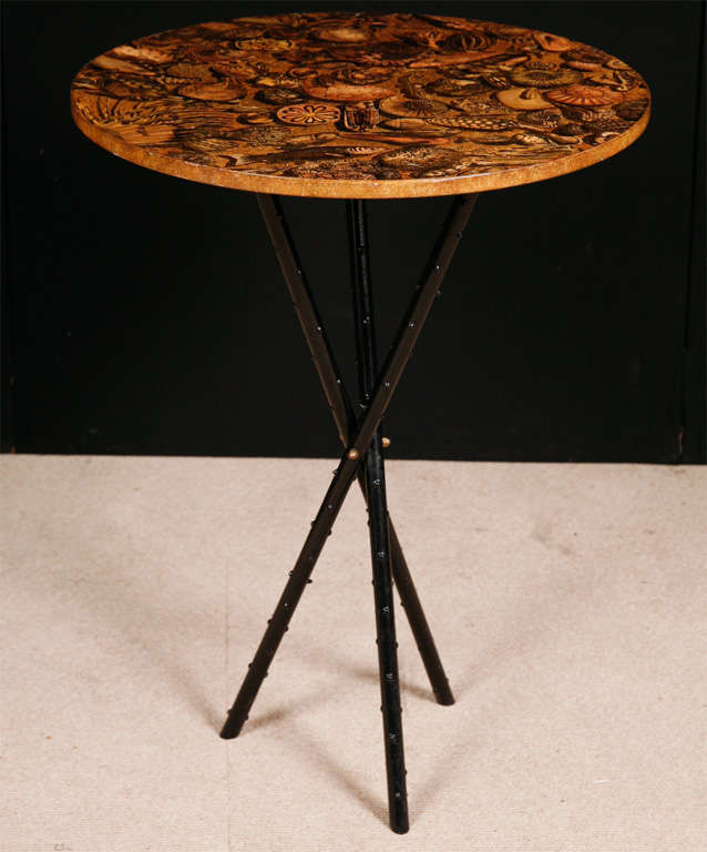An occasional table by Piero Fornasetti.
