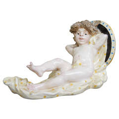 A Italian Majolica Wall Bracket with a cherub