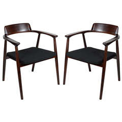 Pair of Modernist Rosewood Arm Chairs with Curved Back Design