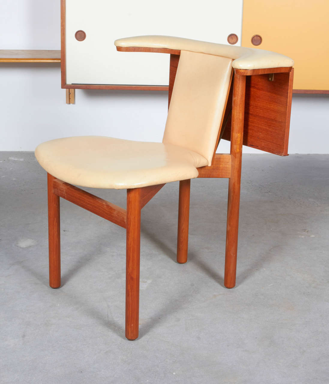 Vintage 1960s Teak Occasional Chair by Hans Olsen  

King Frederik of Denmark was known for occasionally sitting backwards on a chair in a common manner. This wonderful design provides arm support and a diminutive desk capable of supporting a pad