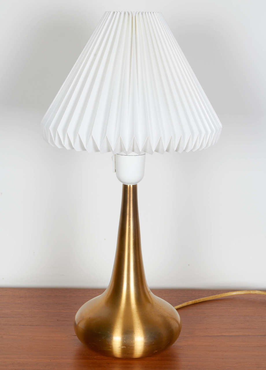 Vintage 1960s Brass Lamp by Jo Hammerborg

This pair of vintage lamps are in excellent condition. Ready for pick up, delivery, or shipping.