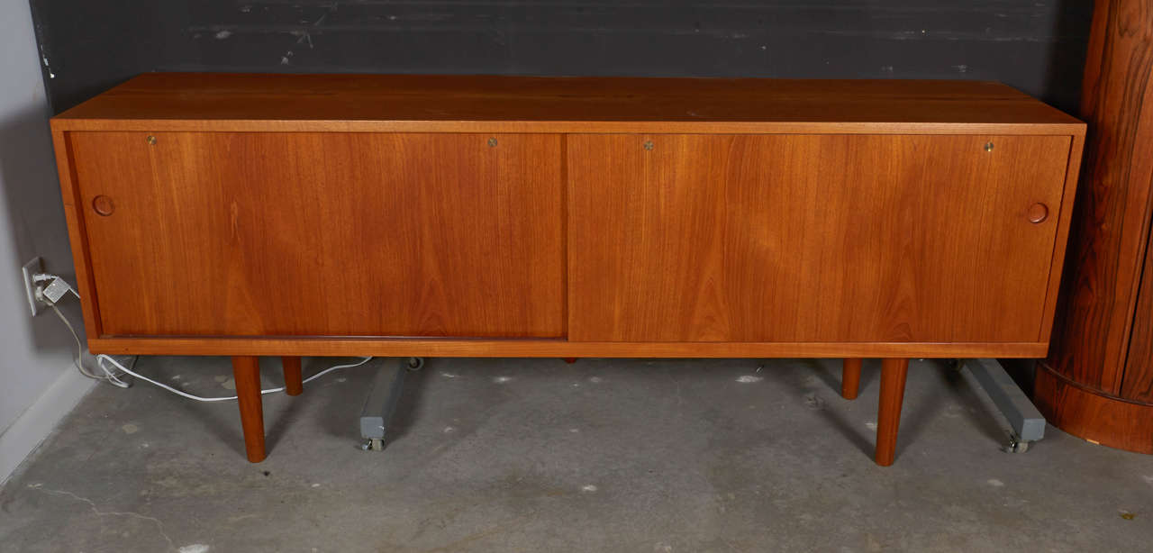 Vintage 1950s Teak Credenza by Hans Wegner

This Danish Sideboard, manufactured by Ry Mobler, is in excellent condition. Perfect for the living room for media, in the bedroom for clothing, or the dining room as a buffet. Ready for pick up,