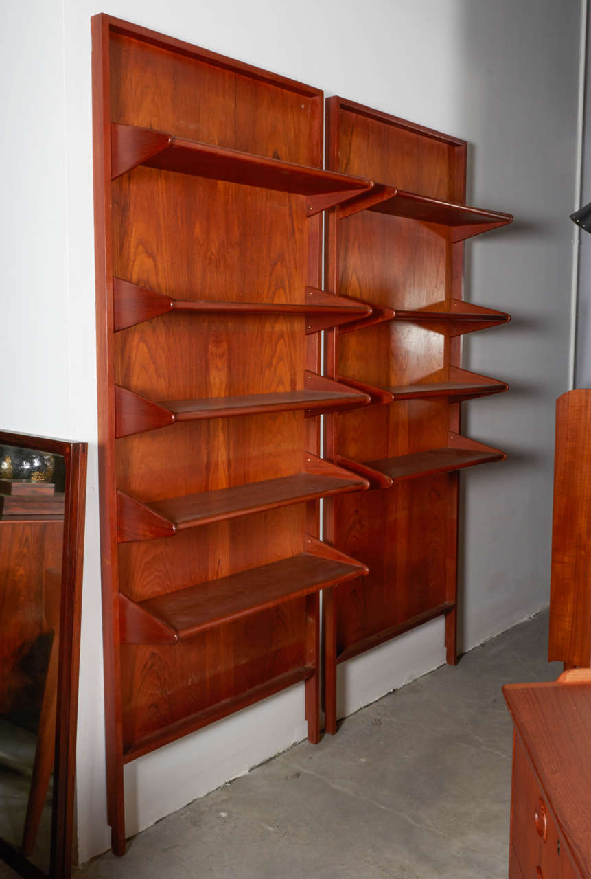 Vintage 1950s Shelving Unit

Here is a rarely seen two section wall system by A. Hovmand Olsen in Teak.  The sections can be placed separately or adjacent and the shelves are removable or adjustable as desired. Ready for pick up, delivery, or