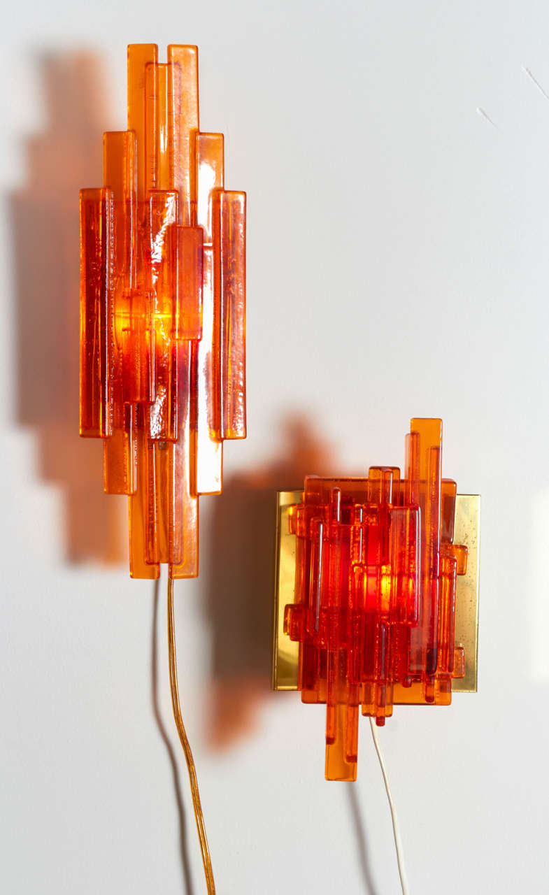 Vintage 1960s Orange Resin Wall Lamps 

This pair of orange lamps mount of the wall with a simple screw and hook. Ready for pick up, delivery, or shipping.