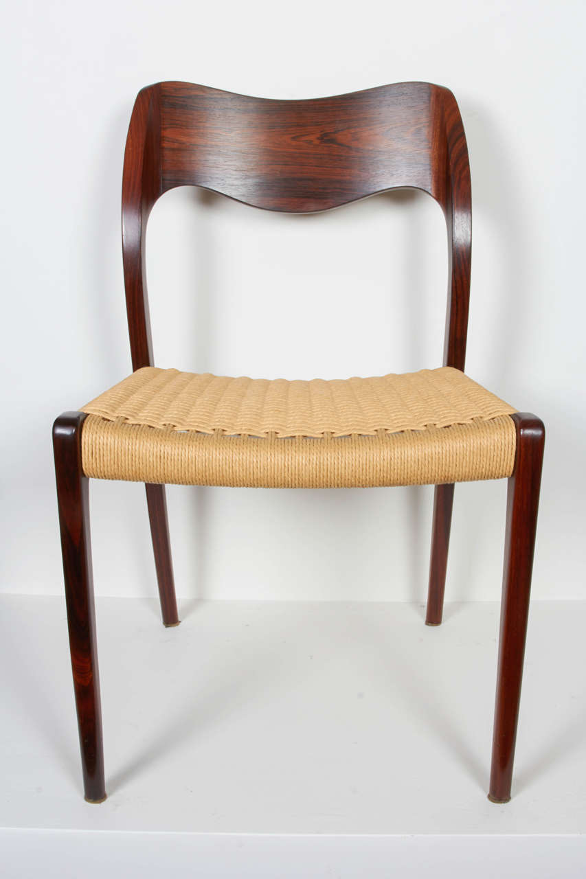 Vintage 1960s Rosewood Dining Chairs by Neils Moller 

This is set of Danish dining chairs are in like-new condition. The legs are solid, and the wavy back makes for a very comfortable, form fitting chair. The paper cord is new. Ready for pick up,