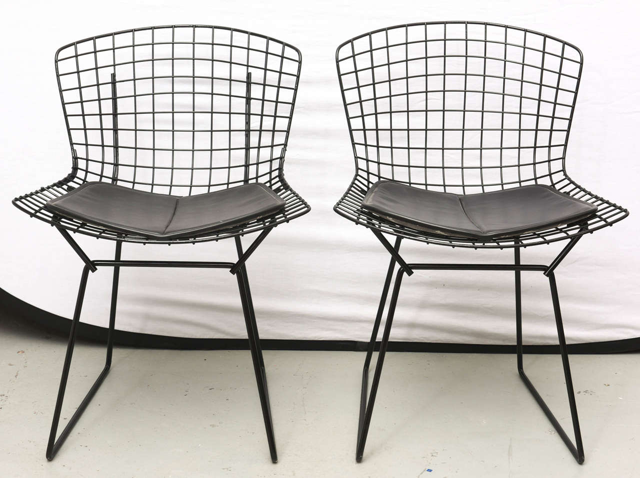 Original Bertoia chairs with black leather Knoll Cushions.  USA 1960s