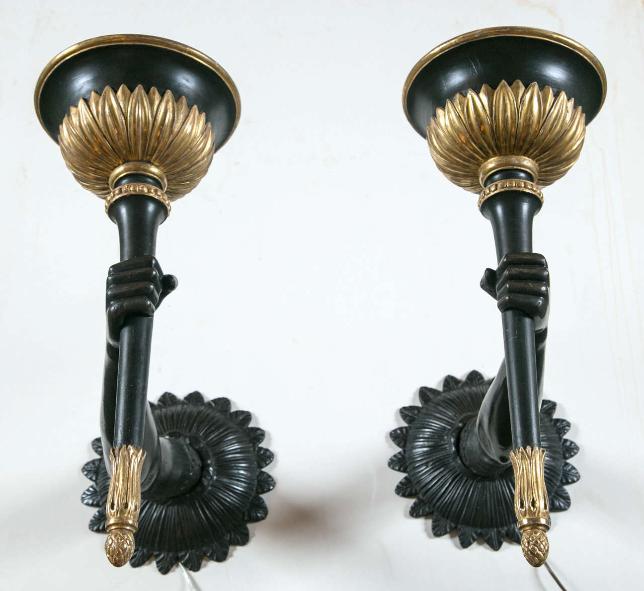 Mid-20th century bronze and parcel-gilt wood Venetian style arm sconces.