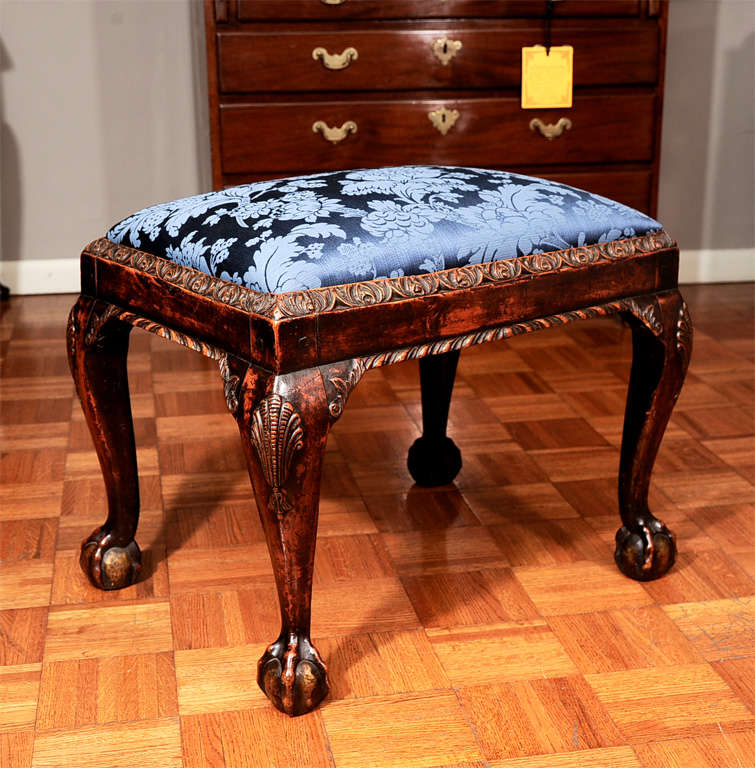 Georgian mahogany stool with shell-carved cabroile legs. With ball-and-claw feet.