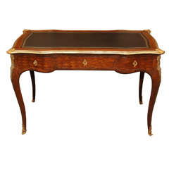 A small Louis 16th Style writing desk with leather top