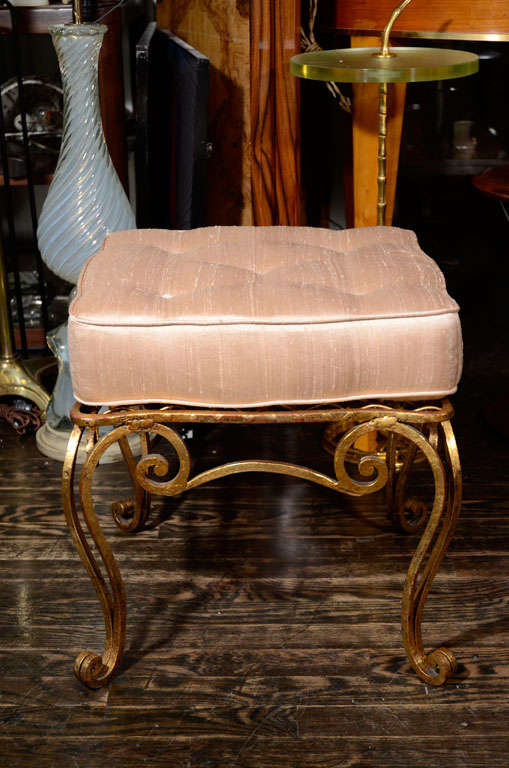 Pair of gilded iron stools with shaped upholstered seat cushions, French 1940s.<br />
17
