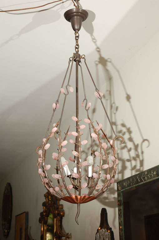Wrought iron forged frame and pink quartz beads. Lantern in the style of Andres Dubrivel. Copper bottom cap and polished brass accents. Bronze finished ceiling cap. Great looking.