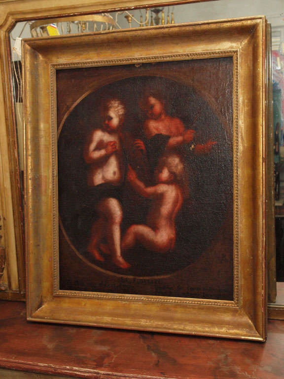 17th C., gorgeous painting of putti's featuring an inscription on the lower portion of the painting, re-stretched on what is an 18th C. stretcher and handsomely presented in a 19th C., French, gilded, frame.