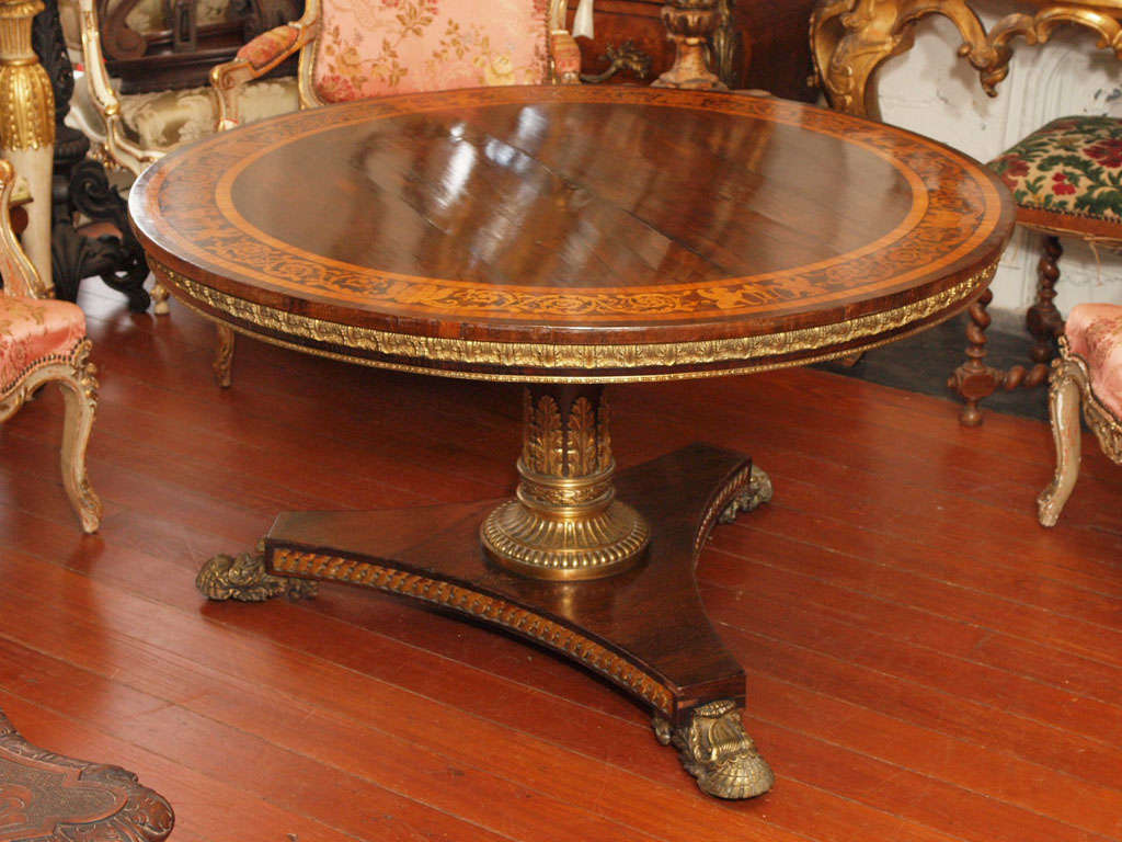 Rare English Regency Supper table with tilt top. Rosewood with yew and kingwood inlay crossbanding and bronze and gilt wood mounts