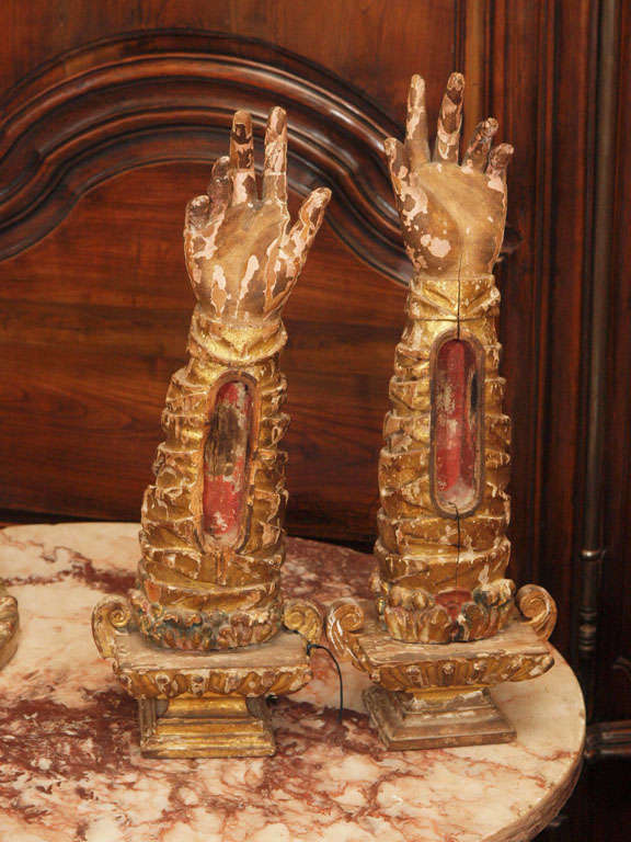 Rare 18th c. carved and gilt,polychrome wood hand on arm reliquaries.