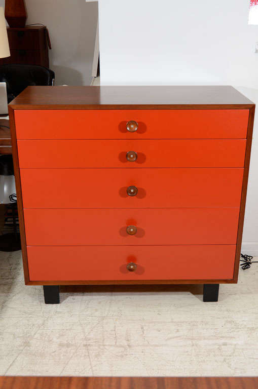 George Nelson basic series dresser, mfg. Herman Miller.  Drawer fronts are lacquered a bittersweet red with cupcake handles.