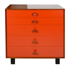 George Nelson walnut dresser with red font and cupcake pulls
