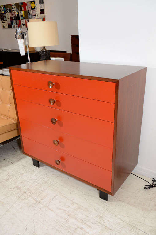 George Nelson walnut dresser with red font and cupcake pulls 1