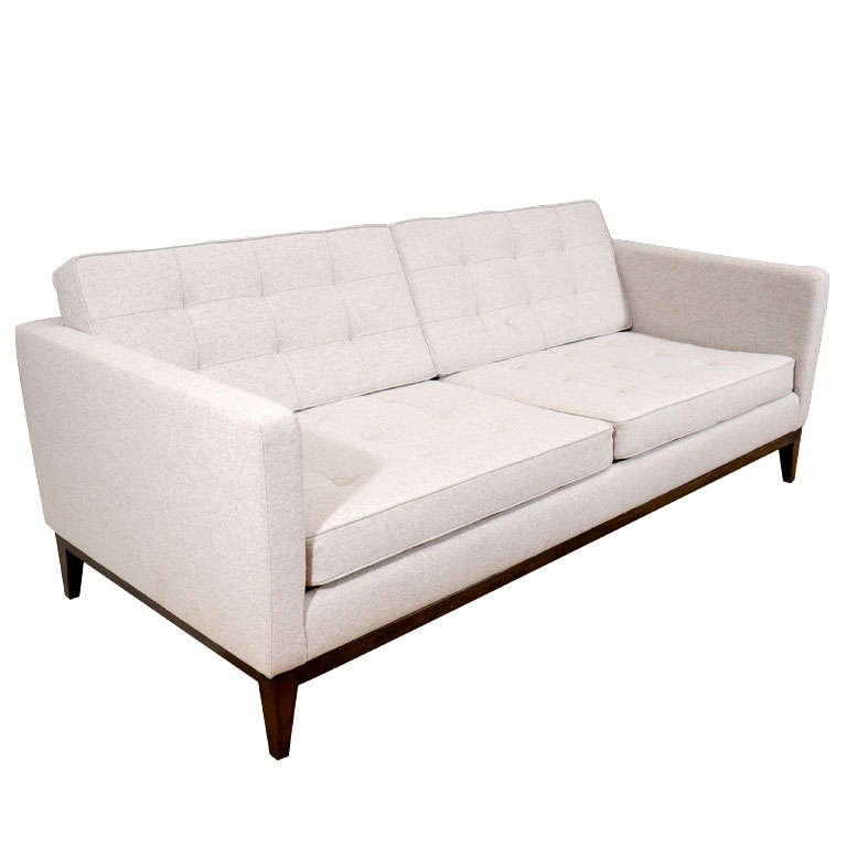 Custom quilted sofa on wood base For Sale