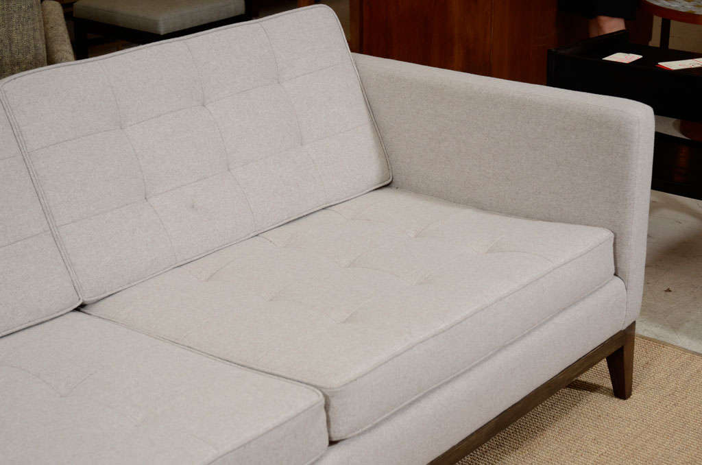 American Custom quilted sofa on wood base For Sale