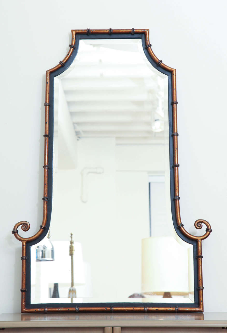 Pair of black and gold painted Asian inspired beveled mirrors c. 1950