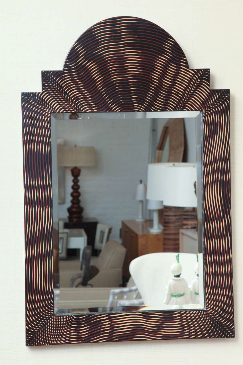 Painted faux palmwood mirror with beveled edge, circa 1980.