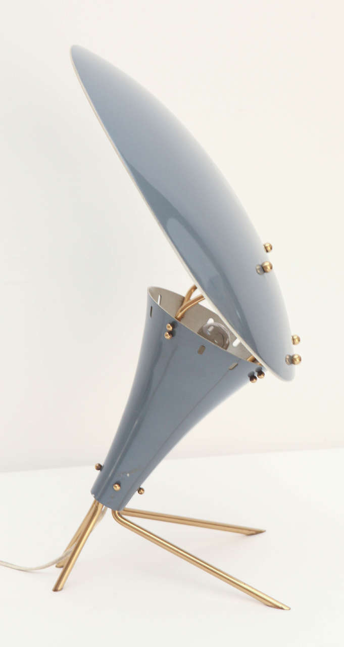 Handsome vintage Arteluce table lamp with grey painted metal and brass details.  Original condition, with a European plug.  We have a US adapter for you, should you need it.