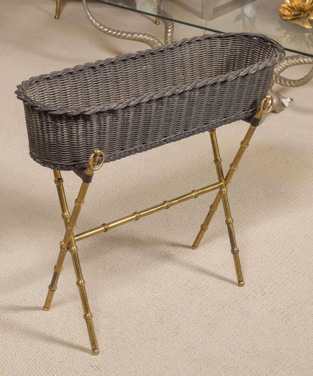 A wicker planter with bamboo motif, gilt brass base, by Jacques ADNET - France,circa 1960.