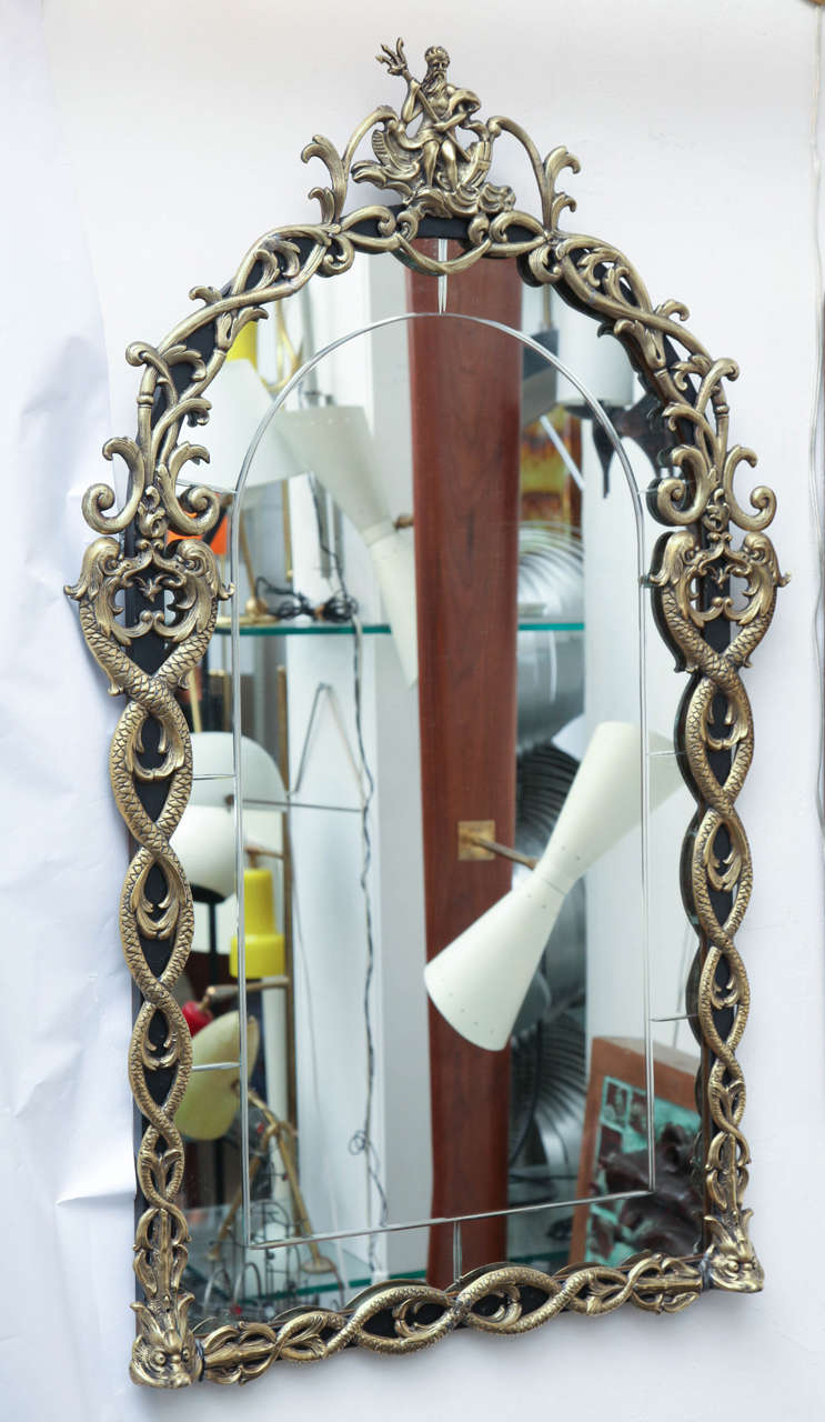 A 1920's Art Deco patinated brass  Mirror en suite with Console