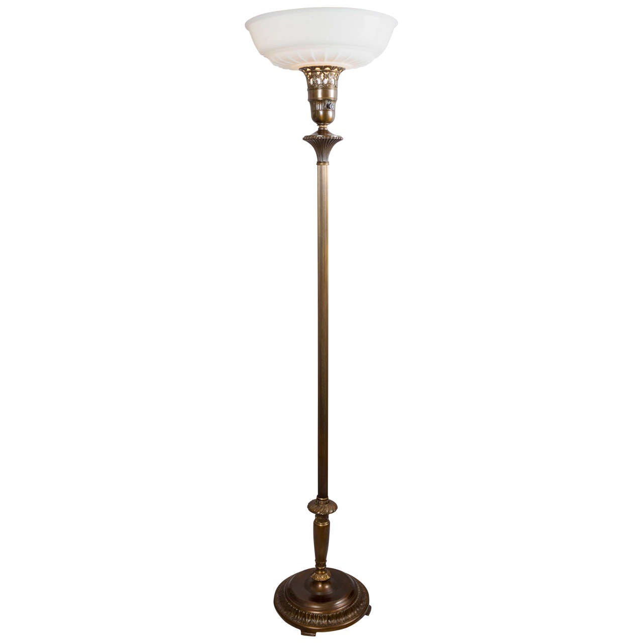 Folks are always asking us for a pair of torchiere floor lamps, and the fact is we rarely get them. Here is your chance. These are an exact pair including the original milk glass shades. Rich patina on the metal,and nice detailing highlight this