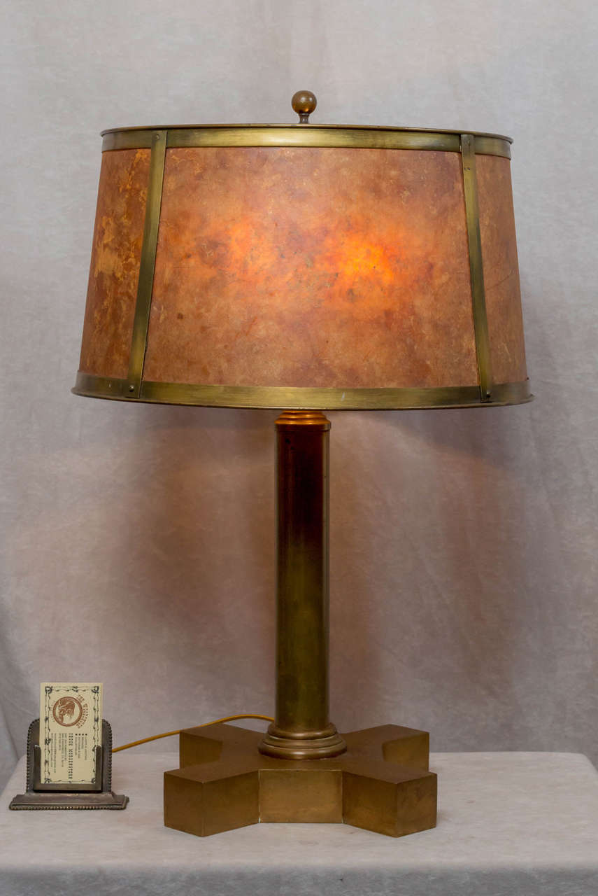 Very unusual handsome bronze and mica table lamp. This lamp is very well made and substantial. There are 2 mica sheets in each segment for greater depth of color. A high quality piece of lighting.