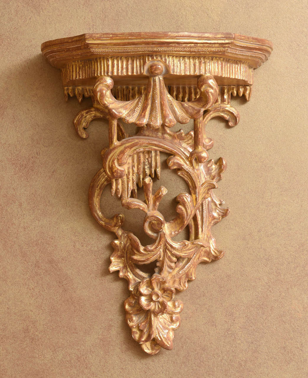 Each fancifully carved with a chinoiserie pagoda over foliate C-scrolls and floral sprays.  A true pair with the decoration in reverse on the other.