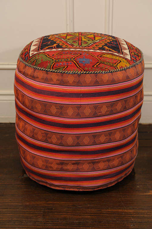 Two different Textiles are used for creating the Pouf.The top part is antique Kilim, 100% wool and the side is Antique Jajim (much thinner and made out of Cotton, but very strong)