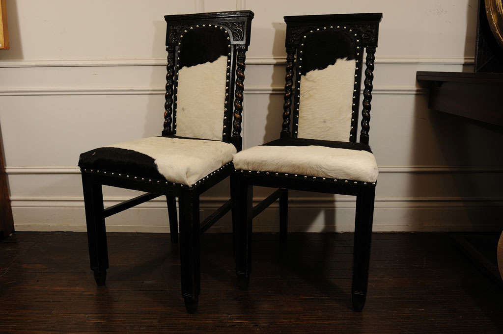Tall Black Chairs with delicate carving on the high back