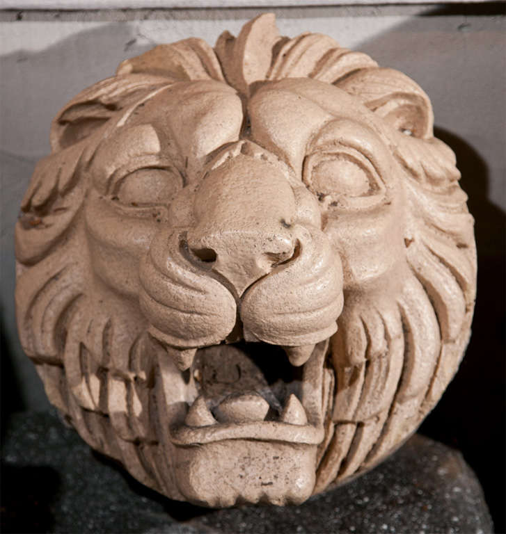 This wonderful and unusual pair of large buff-colored lion roundels originally were embedded in a stone wall that flanked a grand staircase (and they still have some residual mortar). The staircase led from the gardens to an impressive 18th century
