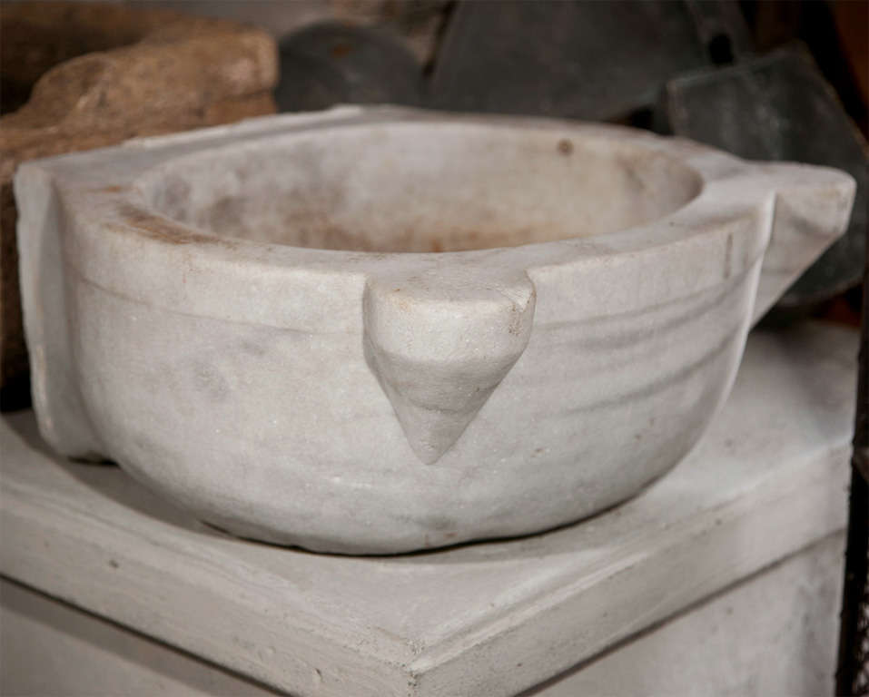 This beautiful oval marble sink with front ears that are perfect for small bars of soap, purportedly came from the baths of Ankora.  With its silky weathered surface, and exotic look, it can be drilled to your specifications to make the ideal basin