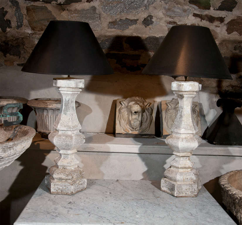 These lamps are real stand-outs! Their large size, elegant baluster form, and beautifully-weathered surface all contribute to make them statement pieces. Sold with simple black shades lined in gold, they would make a stunning addition to your living