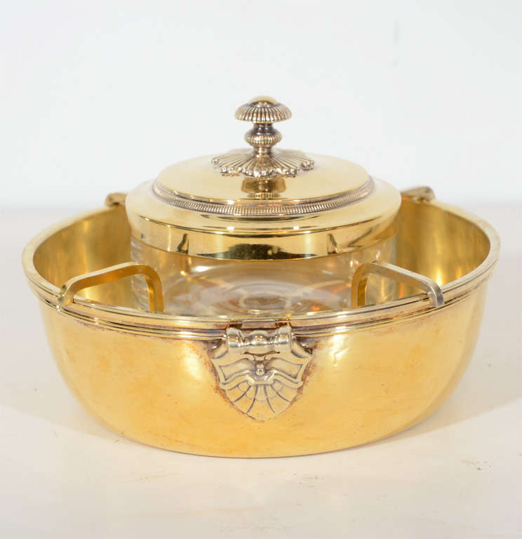 This stunning bowl features an ice holder with glass insert with<br />
stylized Art Deco shell detailing. It is made of sterling with 24k yellow<br />
gold overlay. Signed in hallmark Christofle.