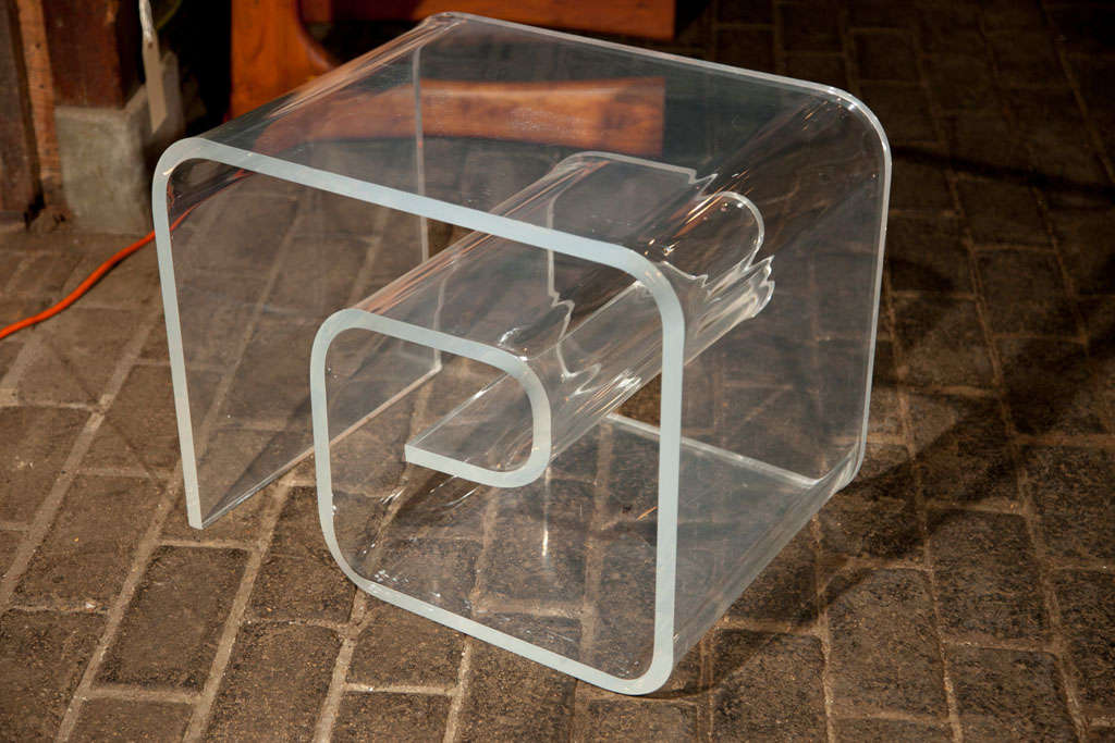 Spectacular, heavy lucite side table with a great Greek key design.