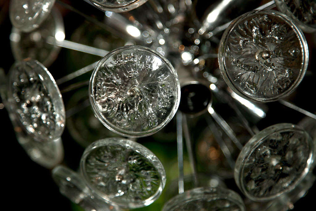 Small Sputnik chandelier with interesting round glass disks and chrome body.