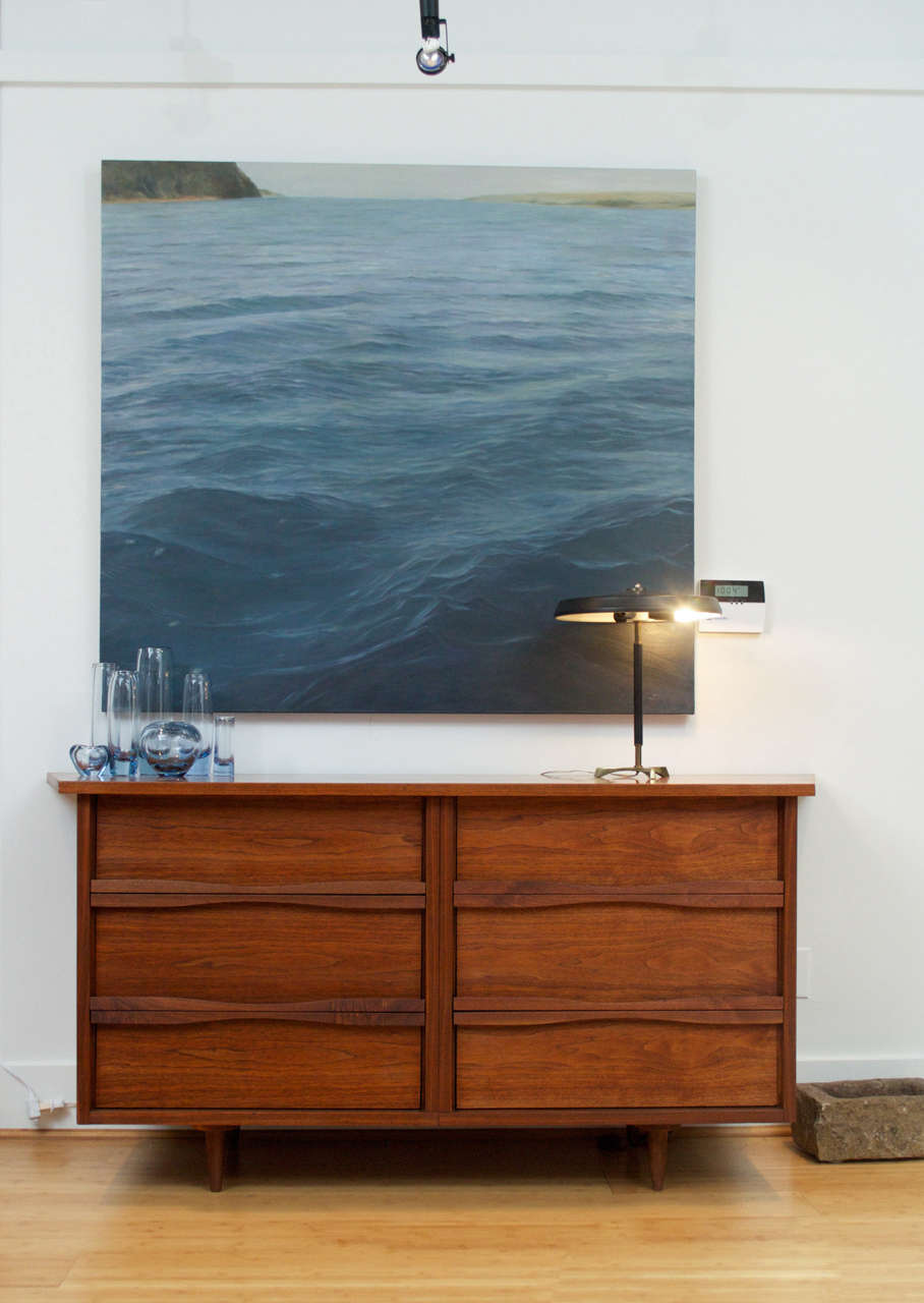 A tall six drawer chest by George Nakashima for Widdicomb. Marked with label drawer interior. American walnut with long, curved drawer pulls and free-edged top.