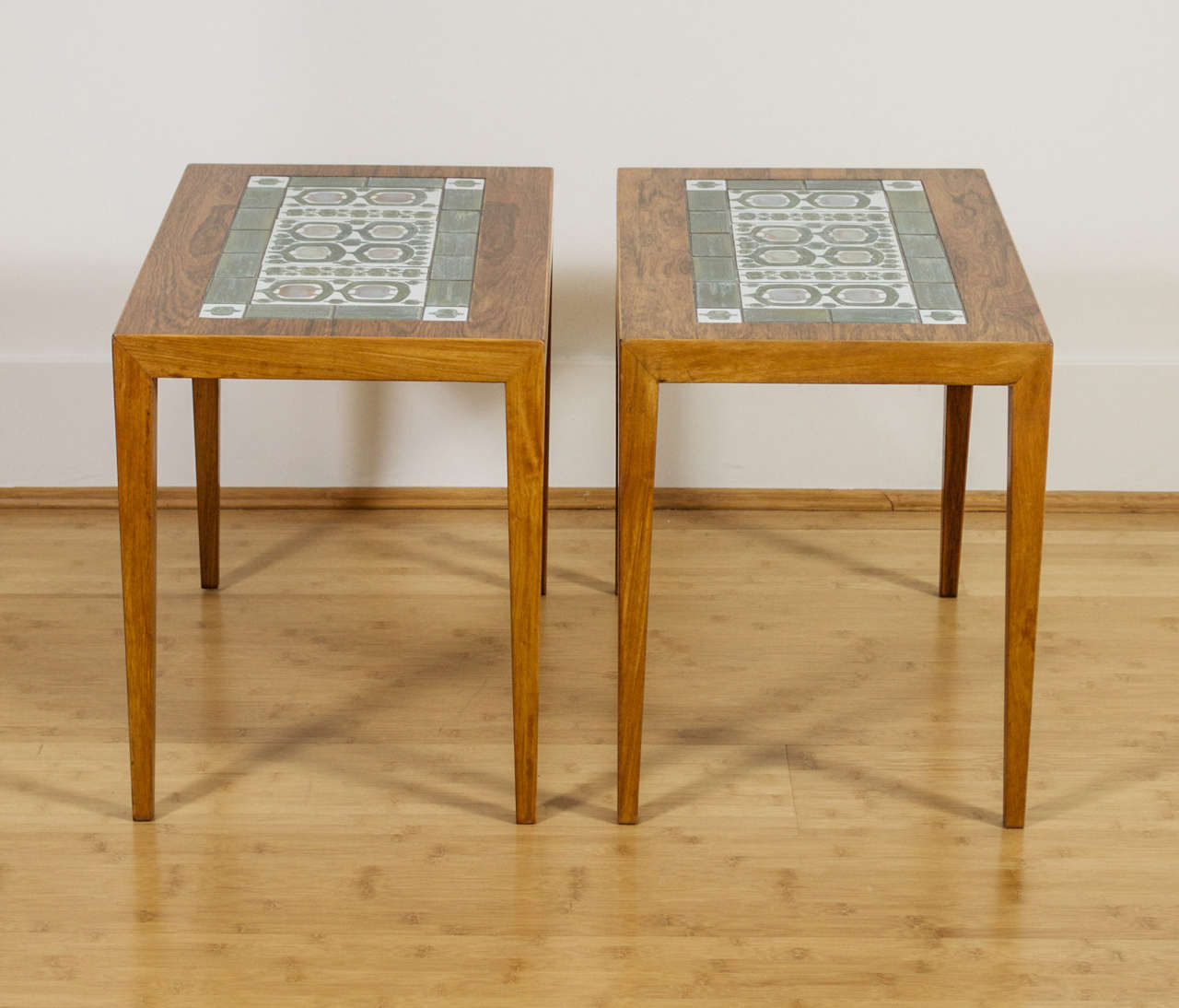 A pair of side tables from Haslev Furniture.  Nils Thorsson tile inlaid in rosewood.