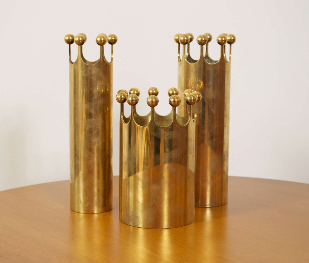 A group of three brass crown vases by Pierre Forsell for Skultuna. Stamped on underside.

Height : 9” 9” & 6”