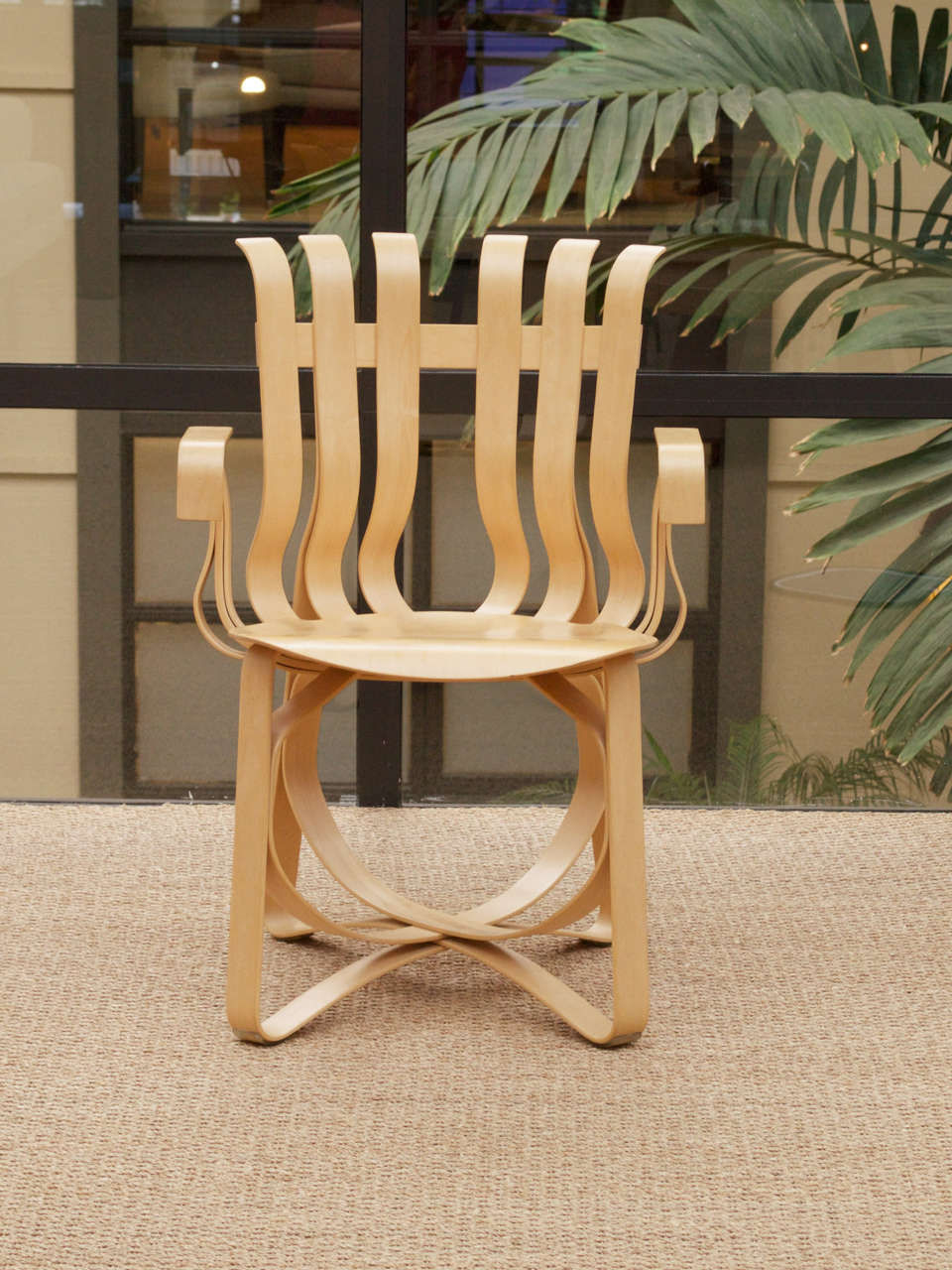 This beautiful bent Maple chair from the Gehry Collection for Knoll is heat - stamped with  Frank Gehry's signature, the Knoll logo,  and the date of production. It is rigid, yet pliant. It offers ergonomic movement and the Maple laths spring back