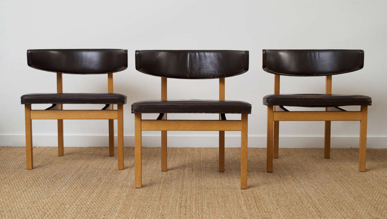 A set of six conference chairs by Borge Mogensen for Fredericia Furniture, model #3245. 

Mahogany frames and chocolate brown leather, with wonderfully curved backs.